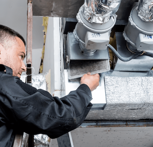 A man cleaning Ventilation