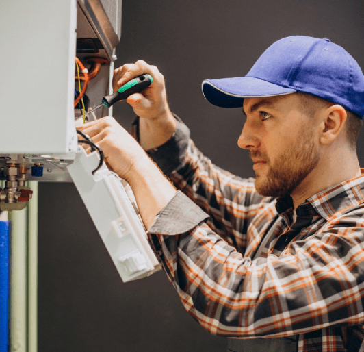 Man adjusting house heating system