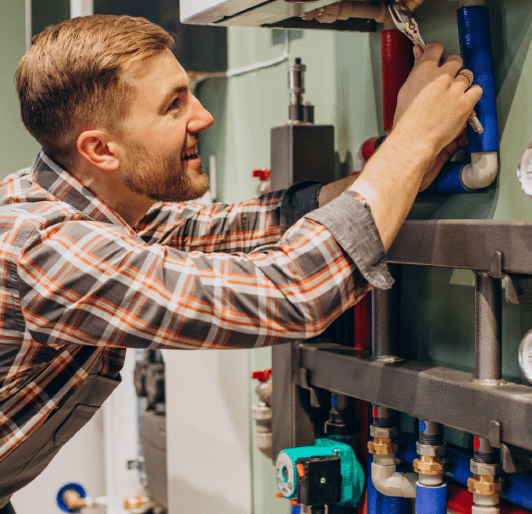 Young engineer adjusting autonomous heating